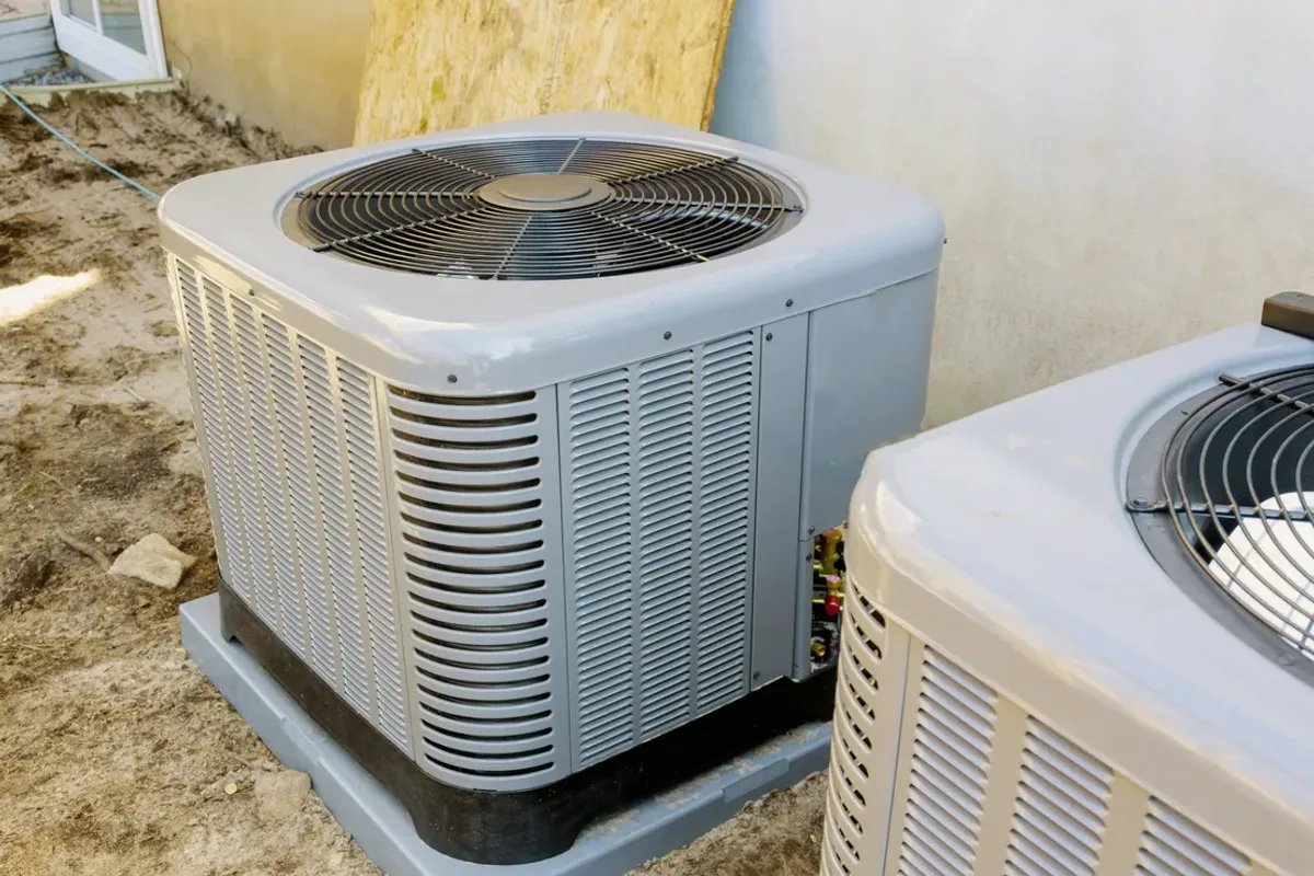 Two outdoor air conditioner condensers